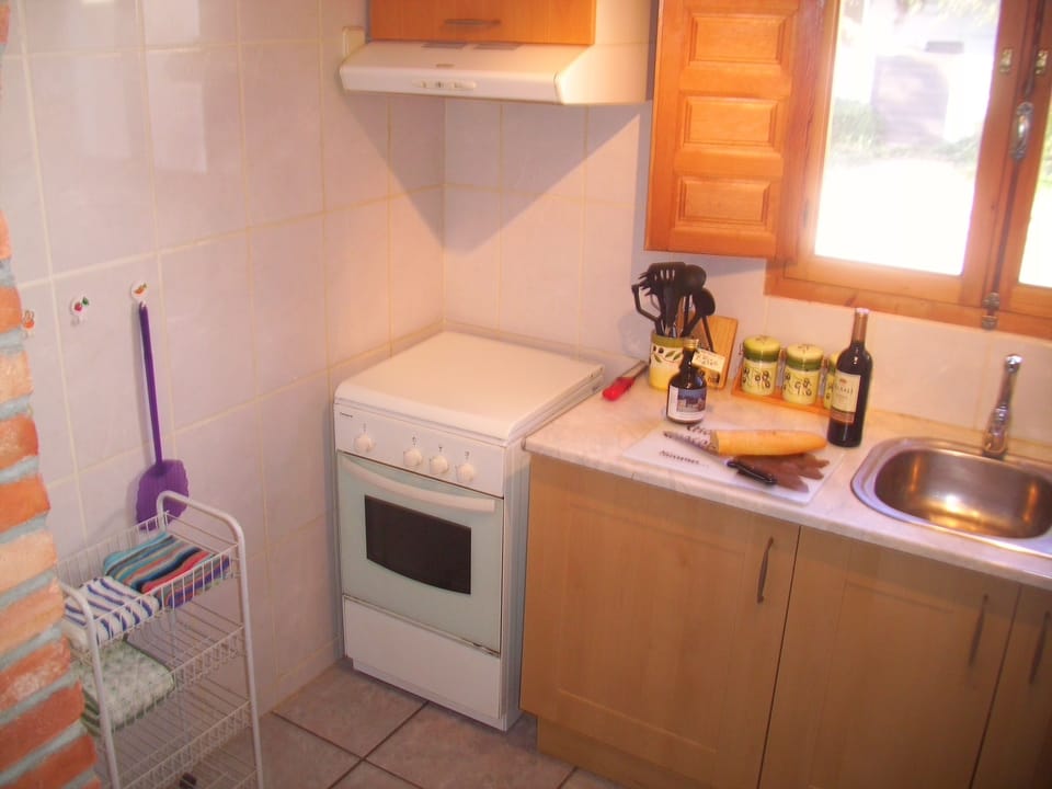 kitchen with oven and gas hob and fridge freezer