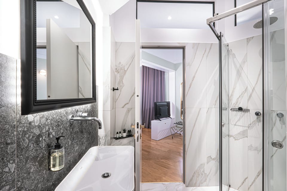 Shower, free toiletries, hair dryer, slippers