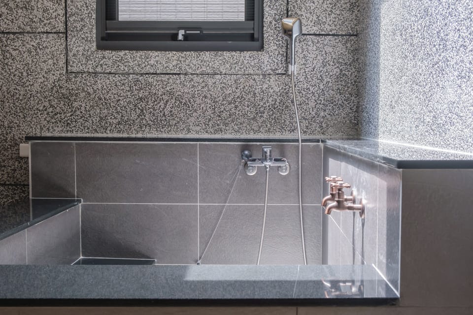 Family Triple Room, Non Smoking, Courtyard View | Bathroom | Shower, rainfall showerhead, hair dryer, bathrobes