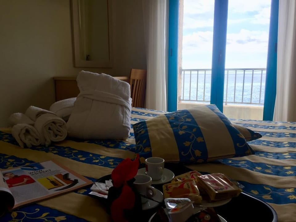 Quadruple Room, Sea View | In-room safe, desk, laptop workspace, soundproofing