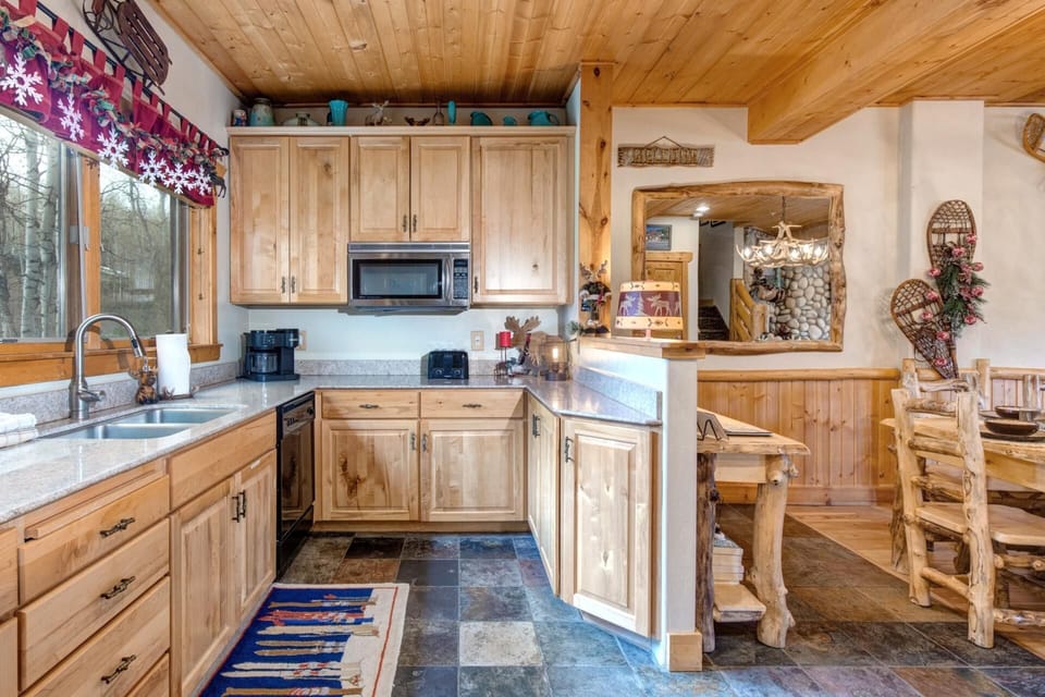 Sophisticated finishes meet casual island comfort in this stylish kitchen.