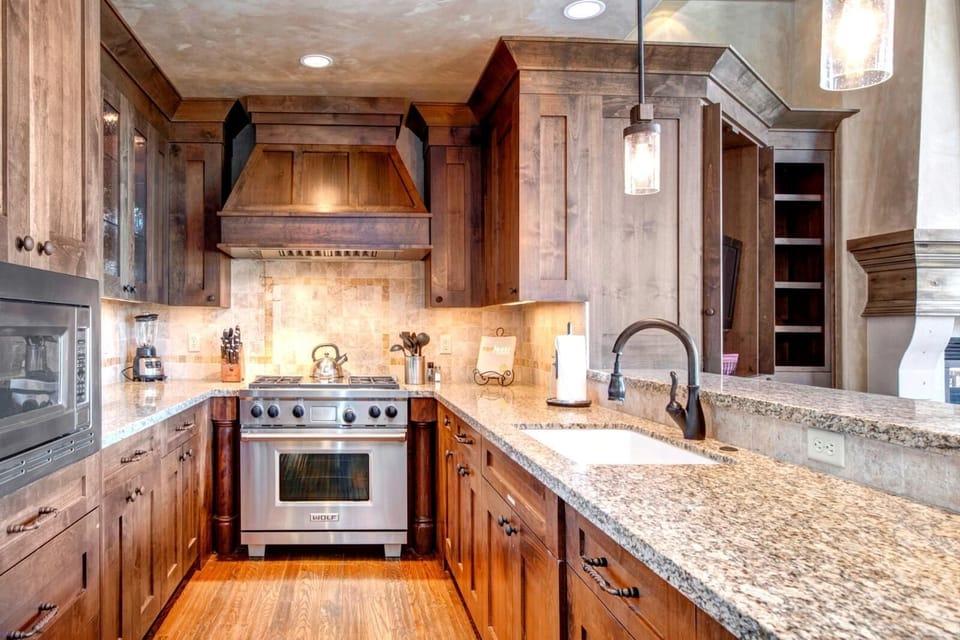 Your gourmet kitchen includes a gas range, granite counters, and high-end appliances for effortless meal prep.