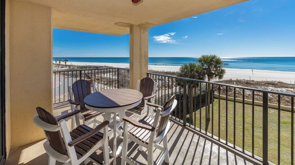 Your balcony invites you to savor morning coffee while warm sunlight dances on the gulf shore breeze