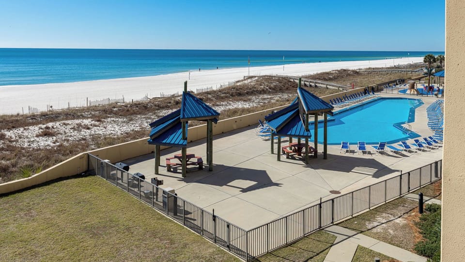 Lounge poolside as you hear children's laughter and gaze across the endless blue coast ahead