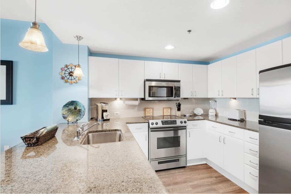 Your fully equipped kitchen features granite countertops, stainless steel appliances, and plenty of space for preparing memorable meals.