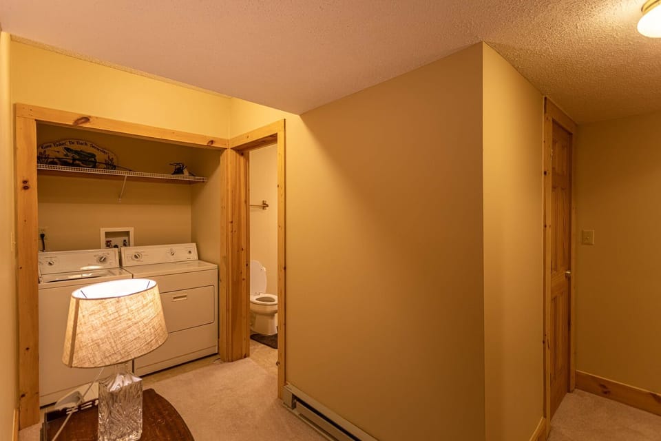 In-unit washer and dryer tucked into a cozy wood-trimmed nook, keeping your mountain getaway worry-free.
