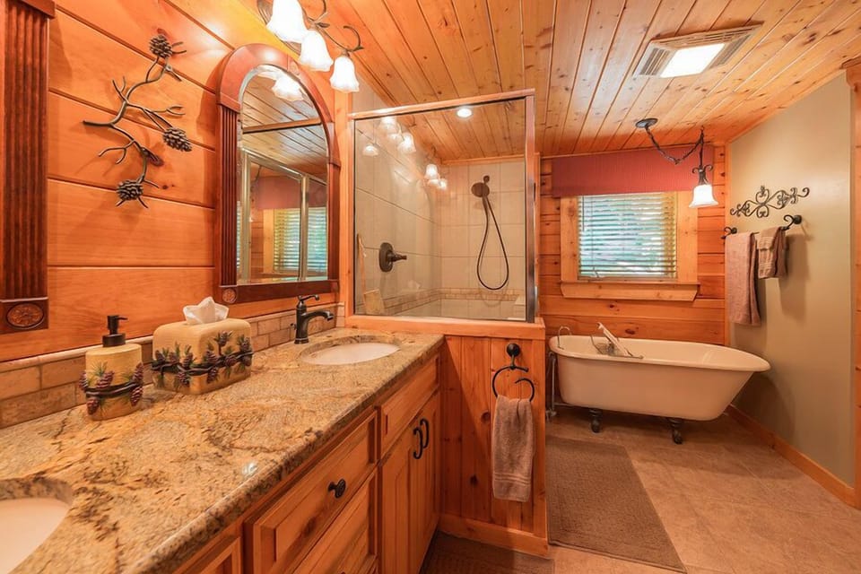 Master ensuite bath with walk in shower dual vanity and claw foot tub