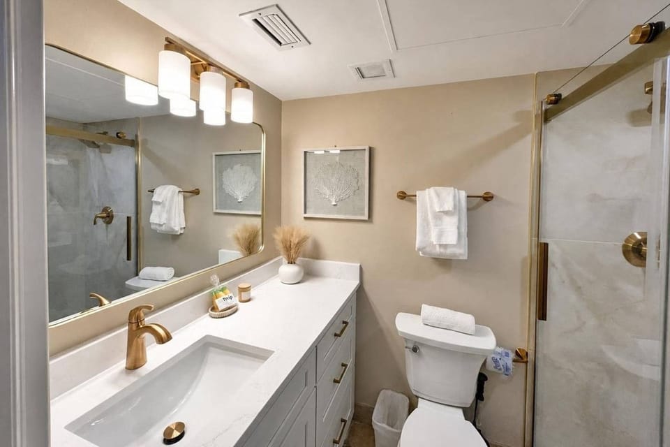 Enjoy modern comfort in the beautifully renovated master bathroom.