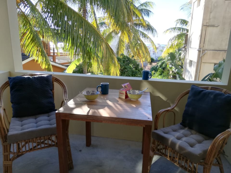Take meals on your private terrace in a coconut tree canopy