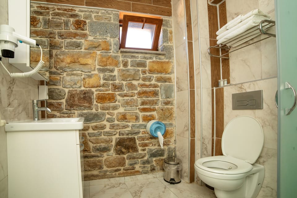Family Room, Lanai, Sea View | Bathroom | Shower, hydromassage showerhead, hair dryer, slippers