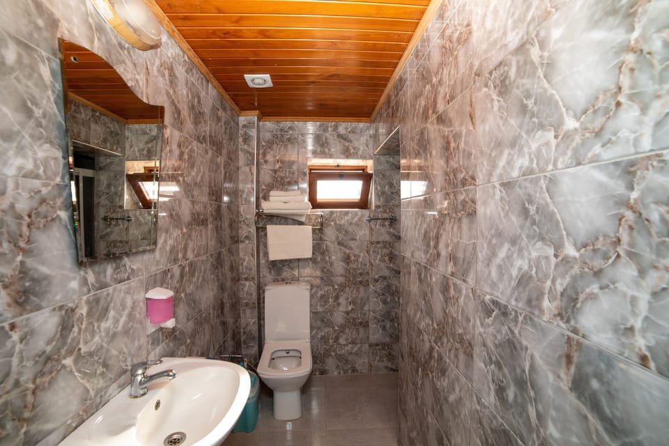 Family Room, Lanai, City View | Bathroom | Shower, hydromassage showerhead, hair dryer, slippers