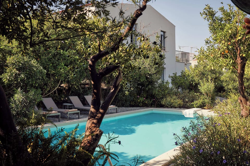 Escape to a tranquil Cretan paradise surrounded by blooming gardens.