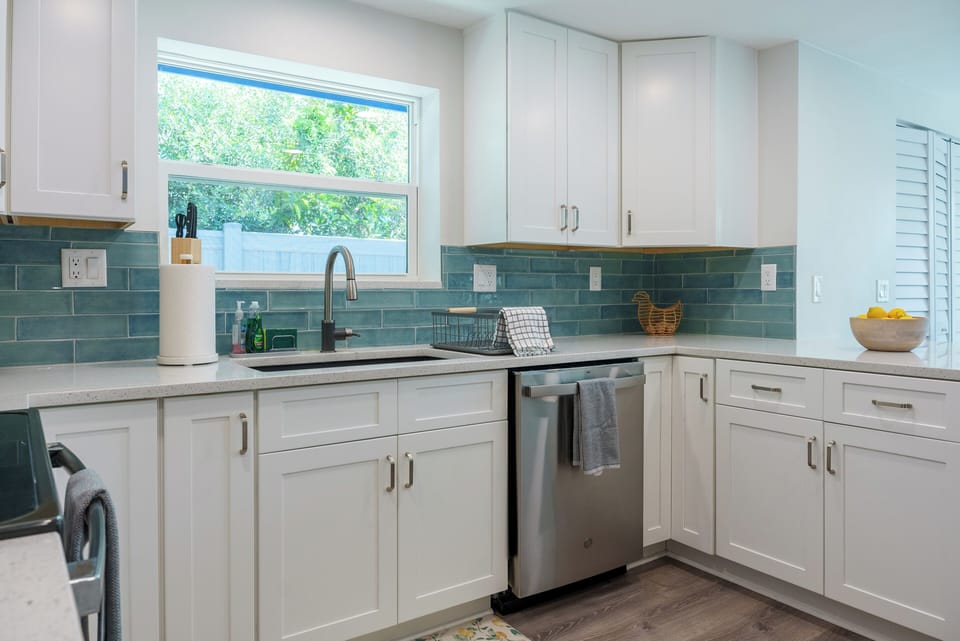 Chef's kitchen with breakfast bar and dining nook