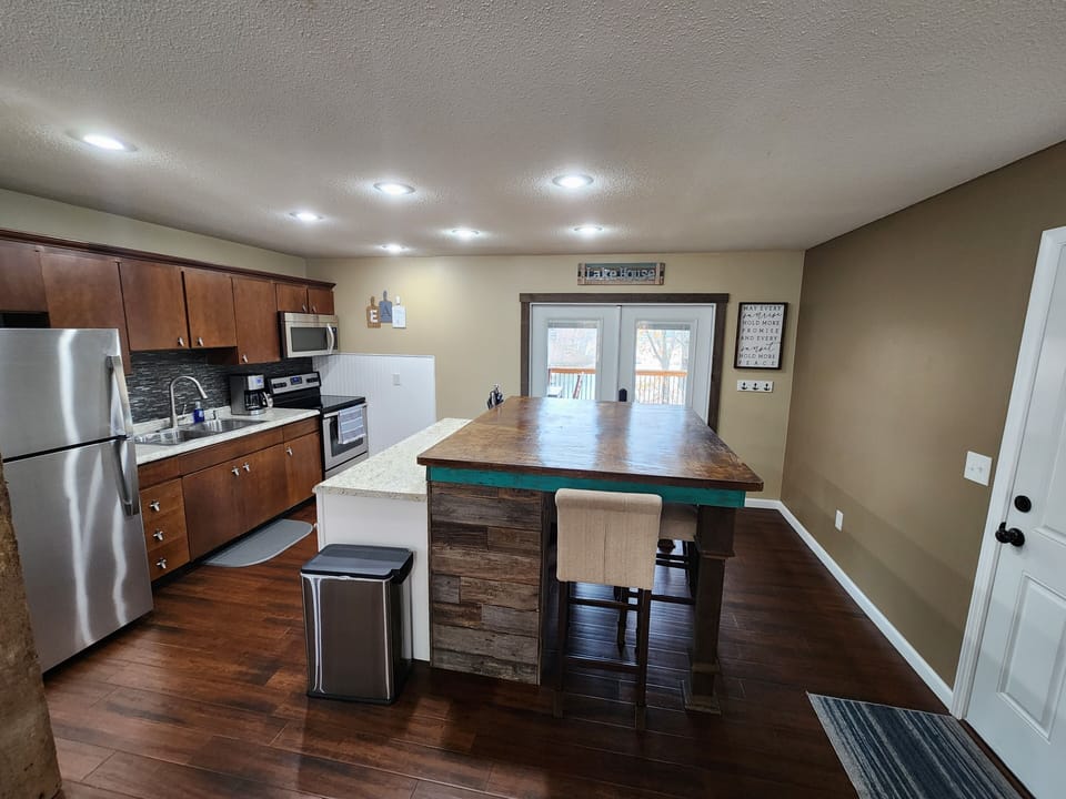 Kitchen area with walk out to covered deck