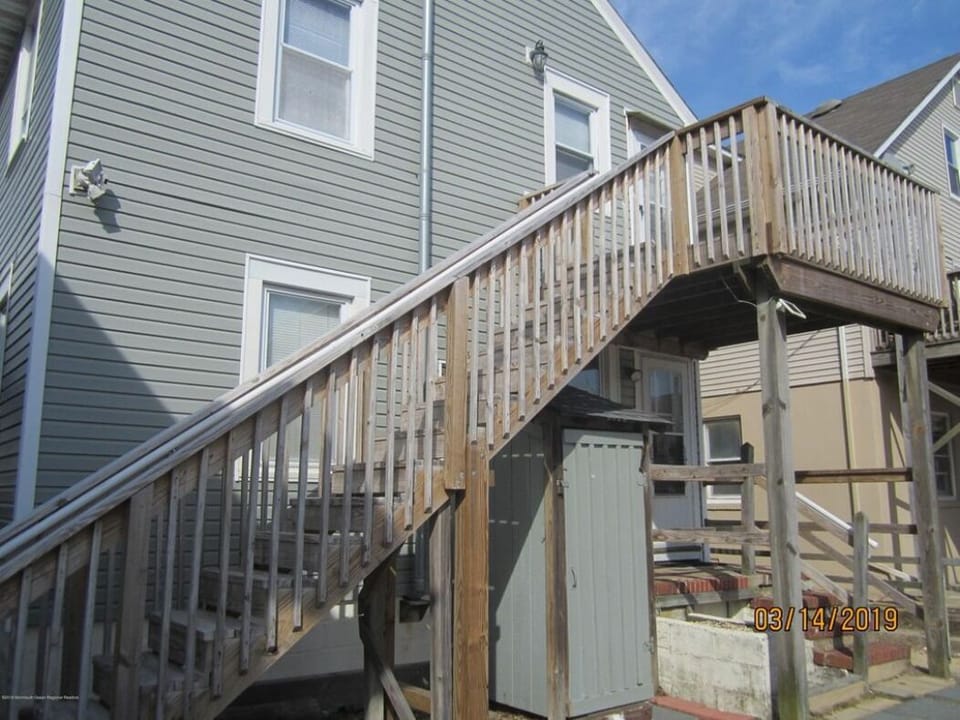 Back entrance + outdoor shower