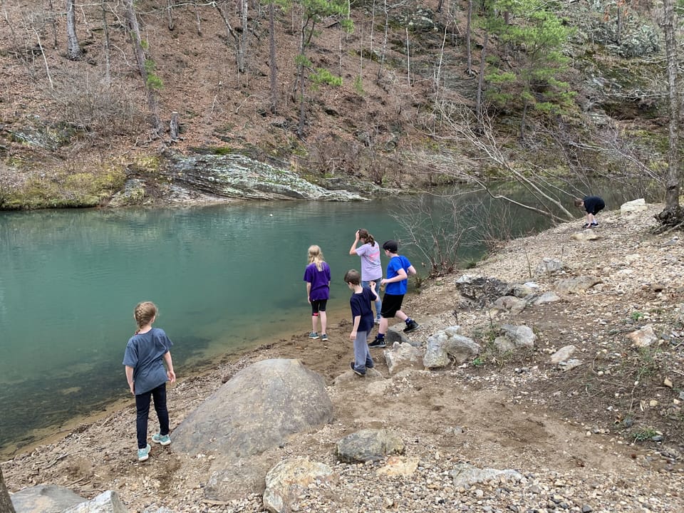 Throwing rocks and having fun at the river just two miles away.  