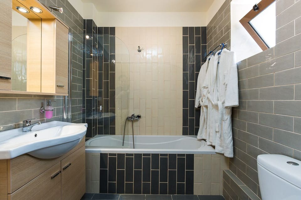 The first bathroom features a bathtub!