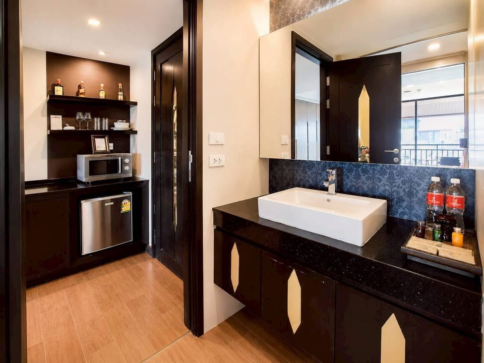 Junior Suite, Pool Access | Minibar, in-room safe, desk, free WiFi