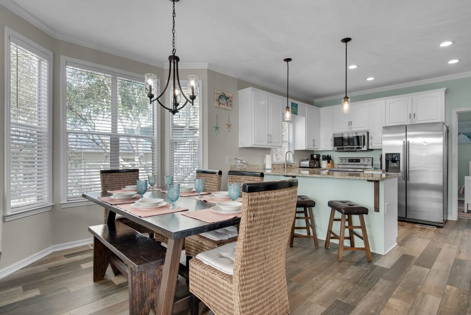 Seating for 12 between the dining room table and 4 barstools.