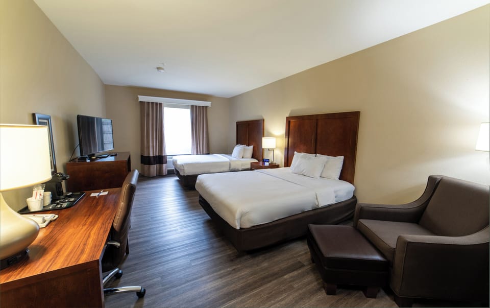 Room, 2 Queen Beds | Desk, blackout drapes, iron/ironing board, free cribs/infant beds