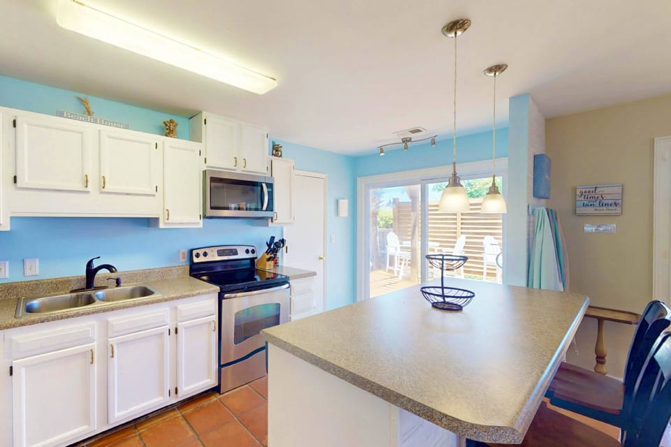 With two sets of sliding glass doors in the kitchen and dining room there is plenty of natural light