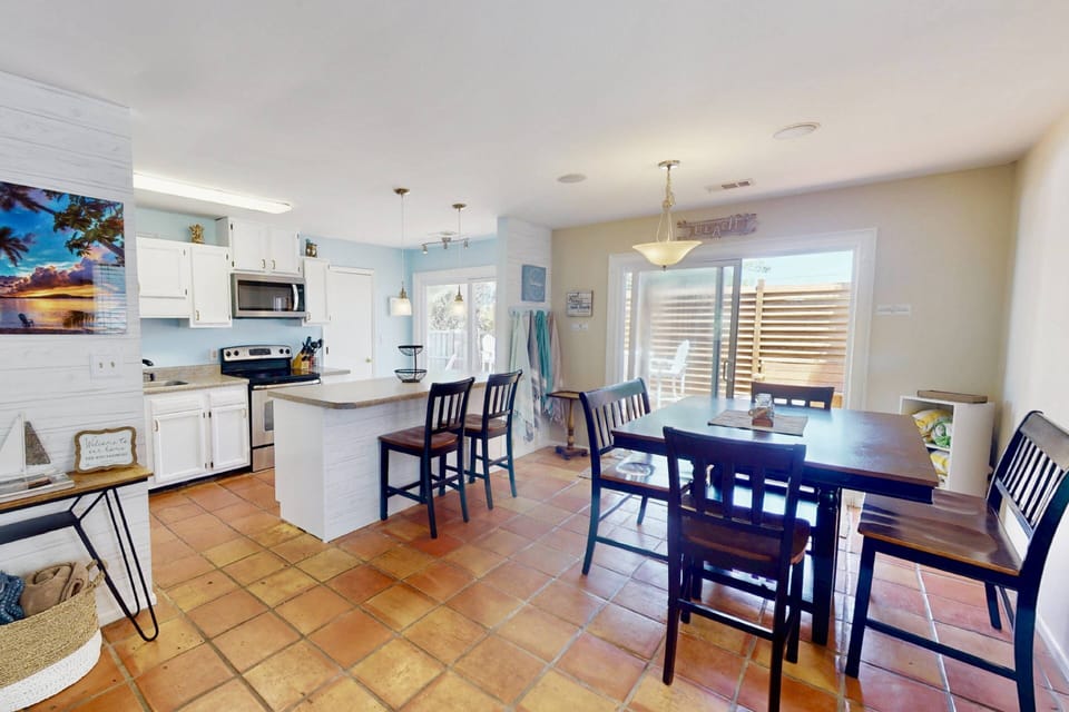 You will have easy access to the pool and the deck through either of the large sliding doors
