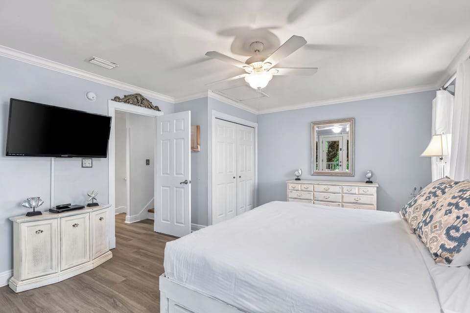 2nd floor King Bedroom #3 is the primary bedroom suite on the second floor with 42" smart tv, balcony access and ensuite bathroom.  Bonus mini-refrigerator with coffee setup.