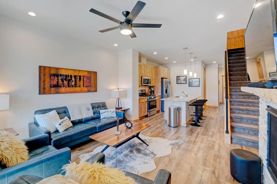 Living Room with Arm Chair, Sofa, Ceiling Fan, Coffee Table