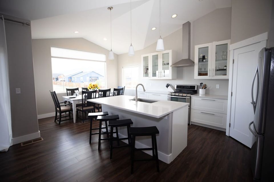 High double vaulted ceilings meet at the heart of the home.