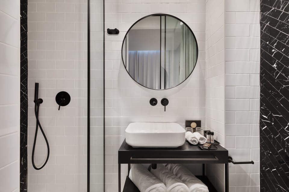 Shower, hair dryer, slippers, towels
