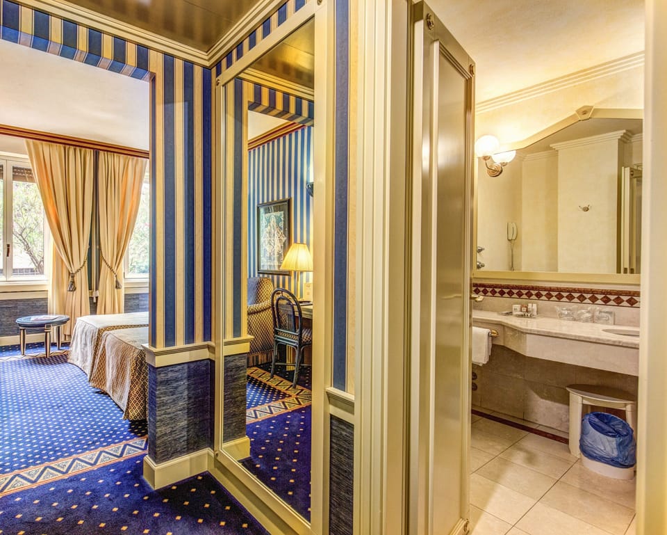 Family Room (2 adults + 1 child) | Minibar, in-room safe, desk, blackout drapes