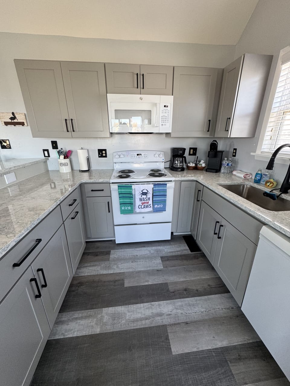 Newly renovated kitchen with quartz countertops.