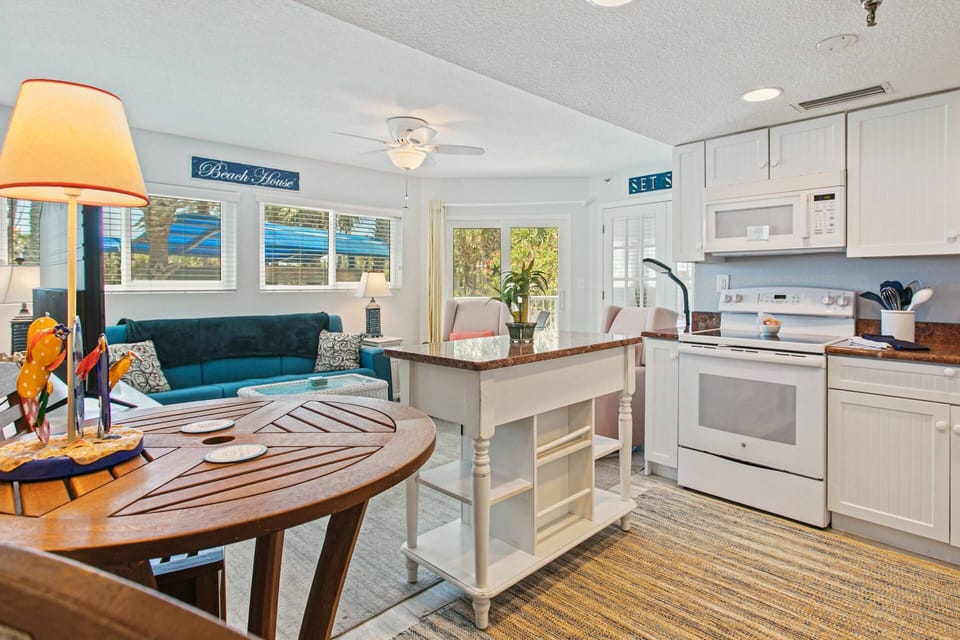 Full Kitchen - Open to the Living Area - and 2 sets of sliding doors to the balcony!