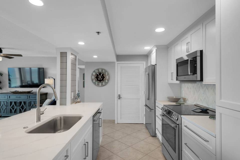 New custom cabinetry, new sink and faucet, new tile backsplash