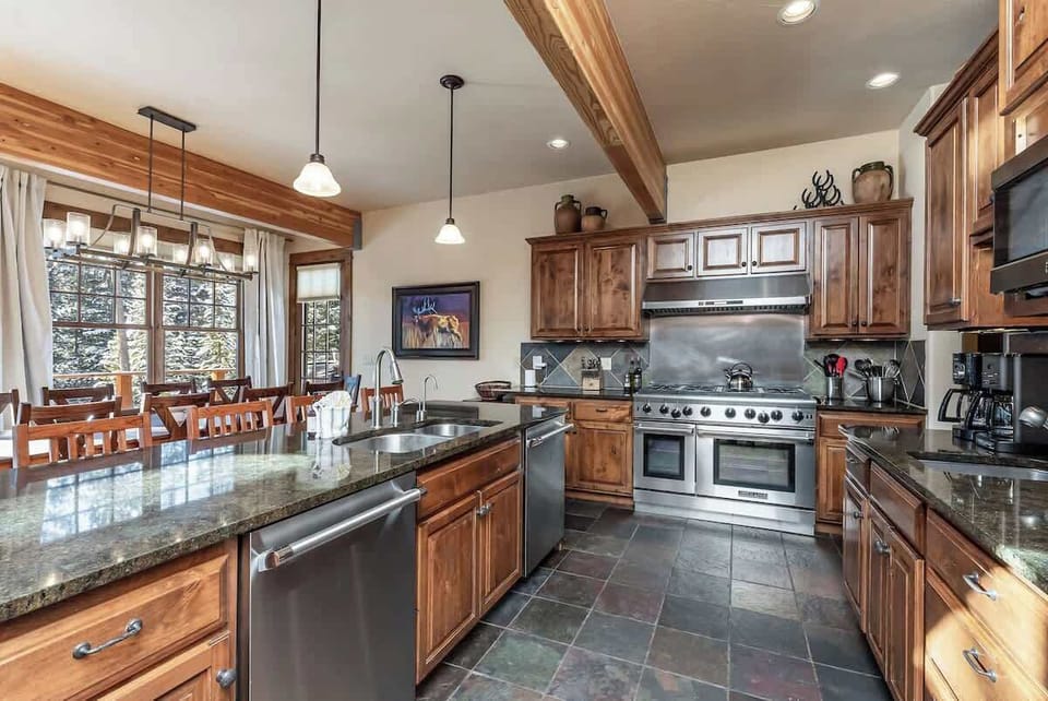 Spacious chef's kitchen with modern stainless steel appliances
