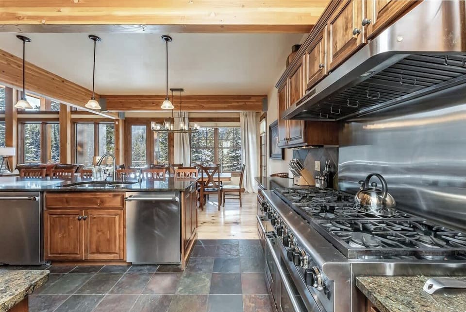 Spacious chef's kitchen with modern stainless steel appliances