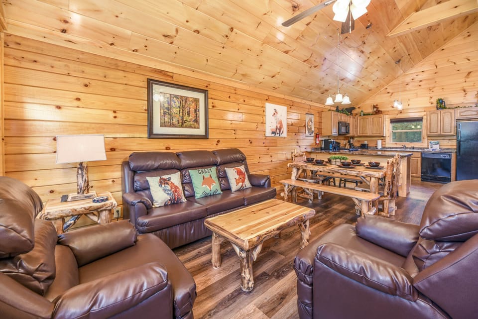 Cozy living room w/ stone fireplace & sleeper sofa