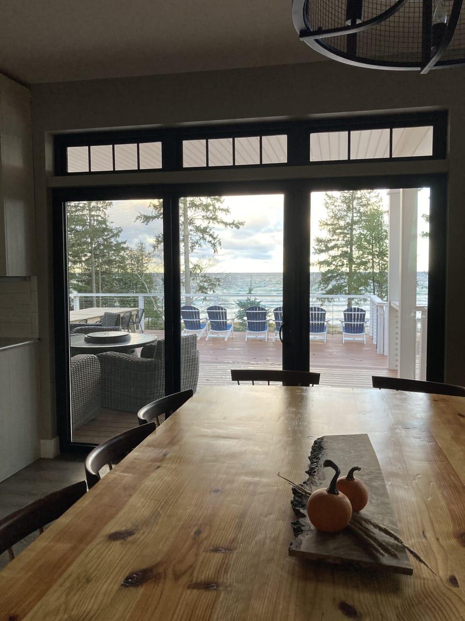 Looking out at deck and water from dining table.
