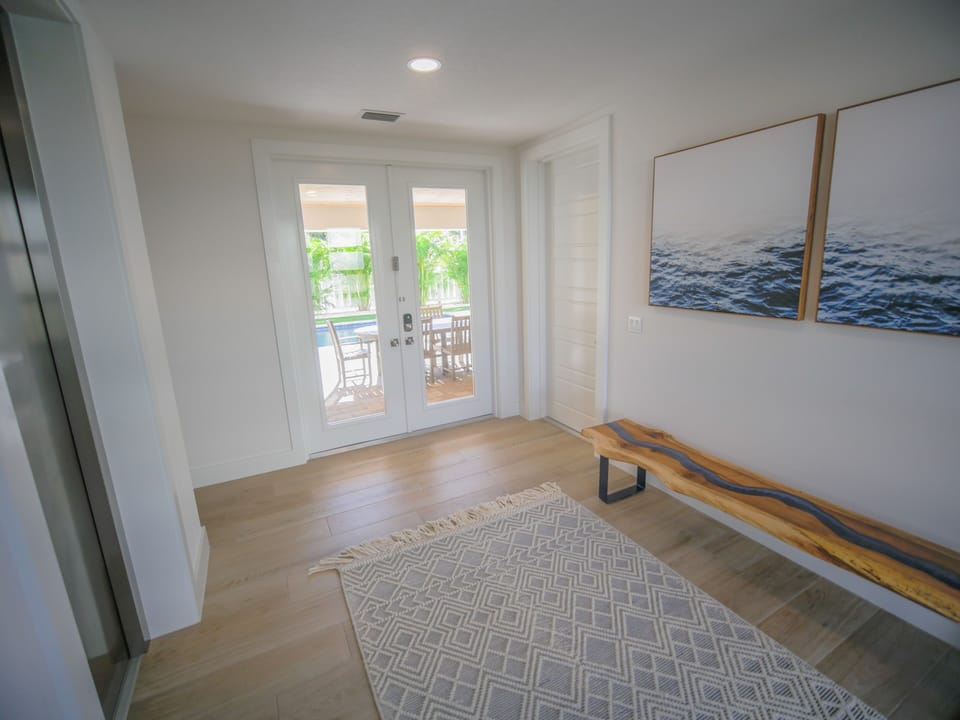 Main entry with private commercial elevator