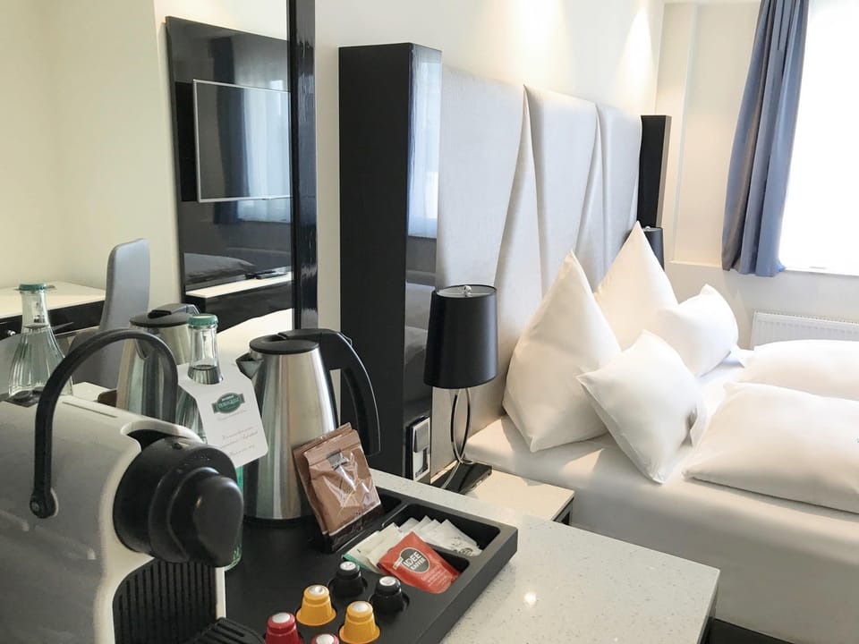 Premium bedding, down comforters, pillowtop beds, minibar