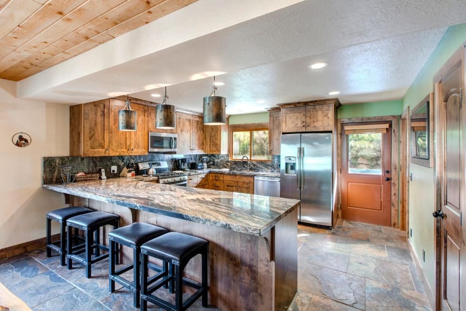 Additional dining space beside the kitchen gives flexibility for larger gatherings or board game nights.
