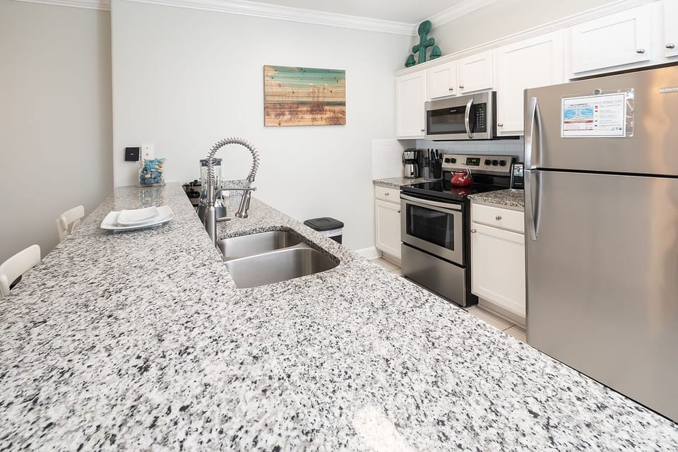 the open kitchen is well furnished 