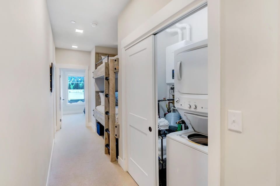 Upper Hallway In-Unit Laundry Room in Our Winter Park Condominium.