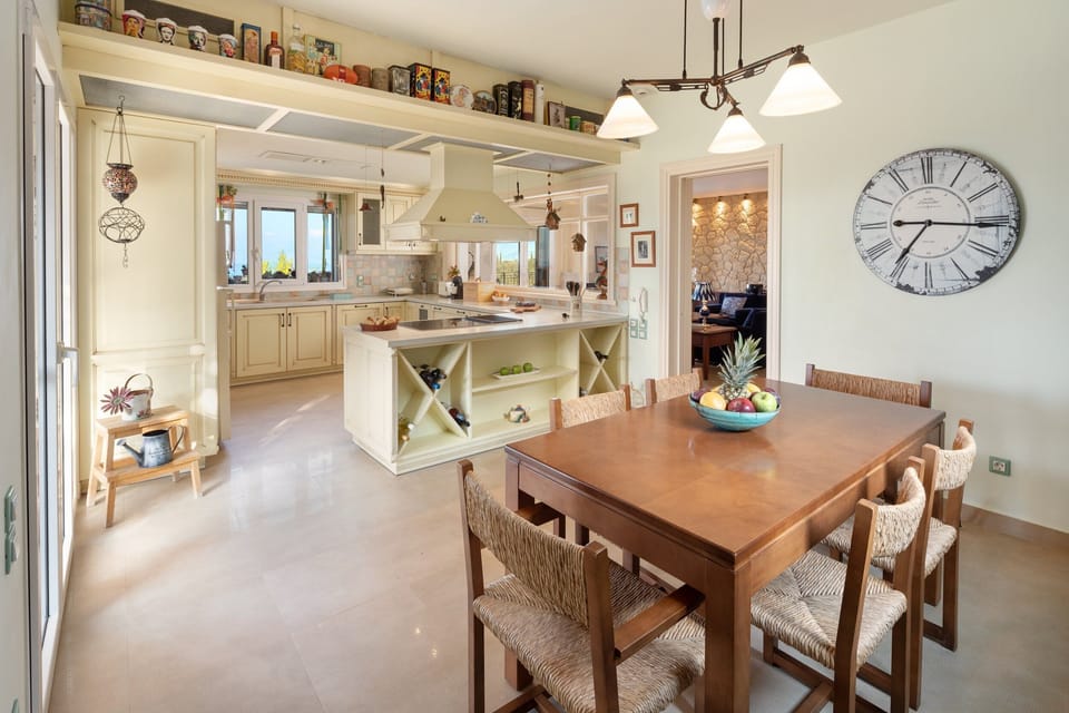 The main full kitchen and indoor dining area with an expandable table