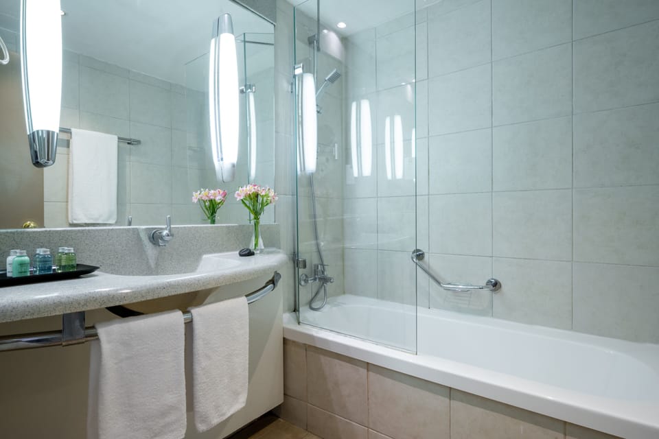 Bathtub, hair dryer, towels