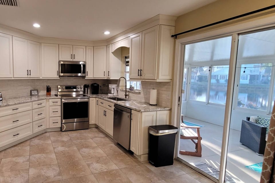 Newly Renovated Kitchen Leads Into The Outdoor Patio Area