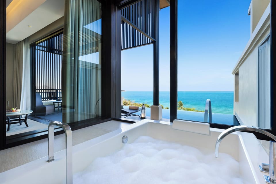 Grand Suite, 1 Bedroom (Ocean View, 1 King Bed) | Bathroom | Separate tub and shower, rainfall showerhead, eco-friendly toiletries