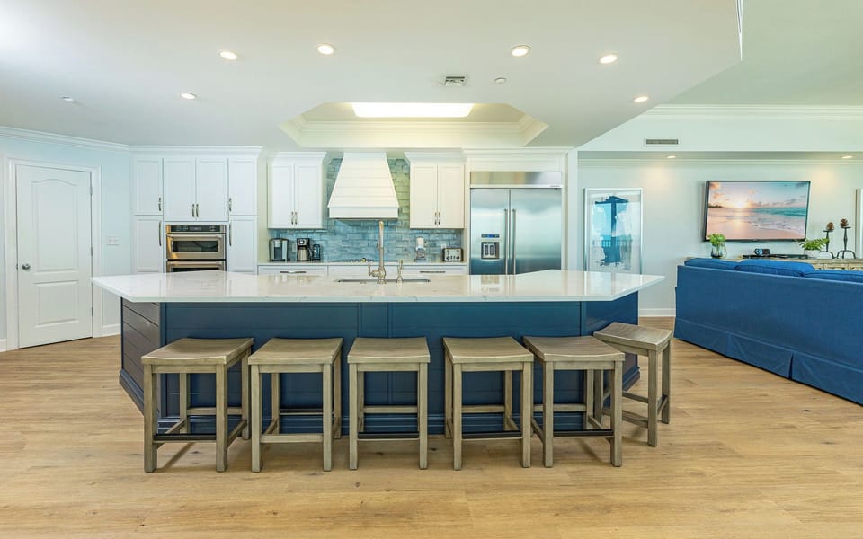 Indulge in family time around the spacious kitchen island, sharing laughter and stories while savoring the coastal vibe