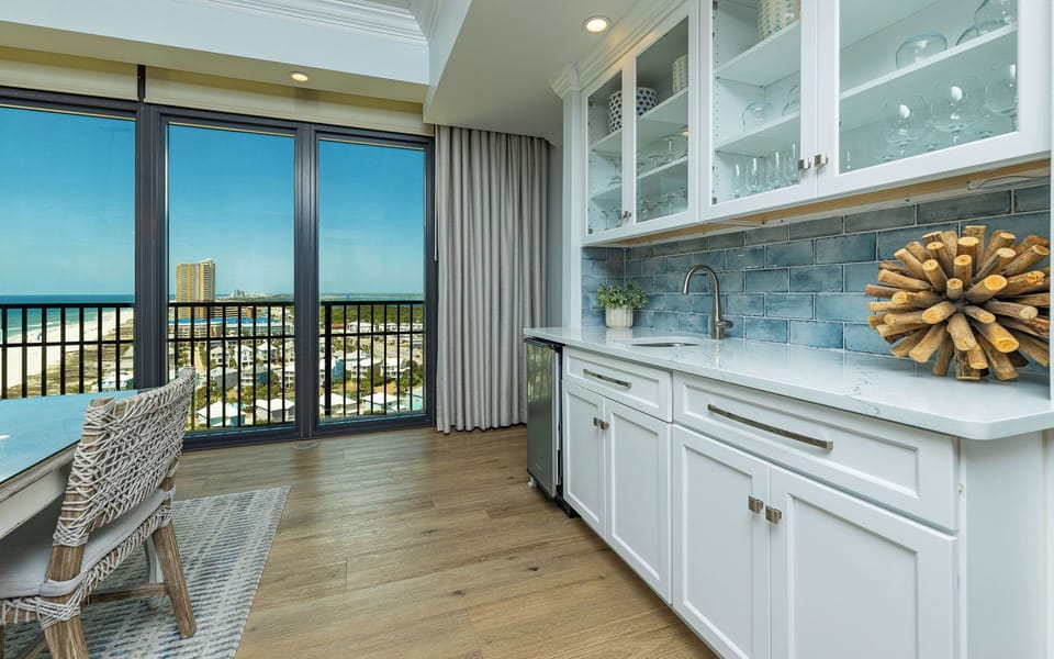 Savor refreshing drinks at your wet bar, while enjoying the serene vibe from the nearby views of the coast