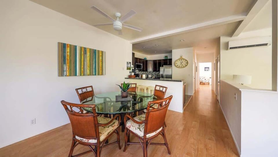 Dining area features ceiling fans and AC for your comfort